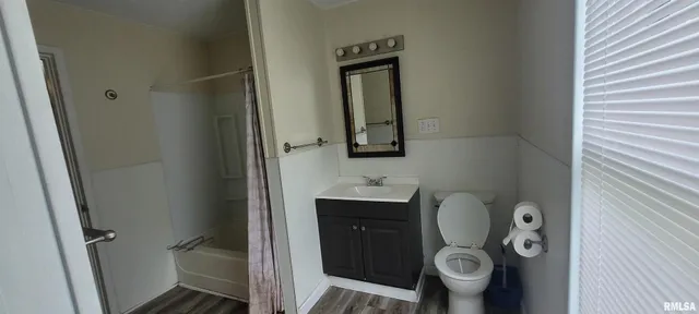 a bathroom with a toilet and a sink