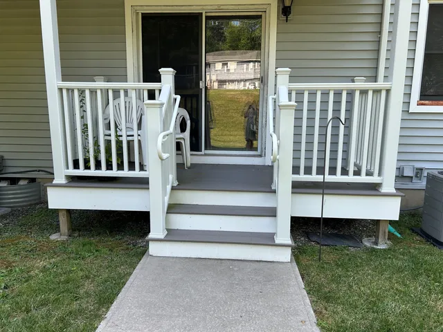 a view of a chair and table in the deck