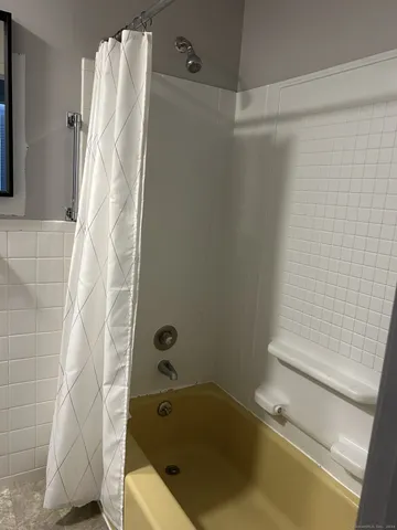 a view of storage and utility room with washer and dryer