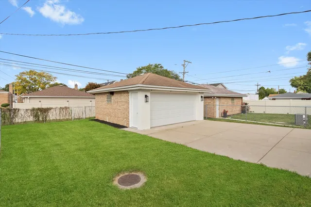 an aerial view of residential building and lake