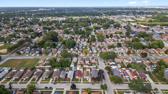 an aerial view of residential houses with outdoor space