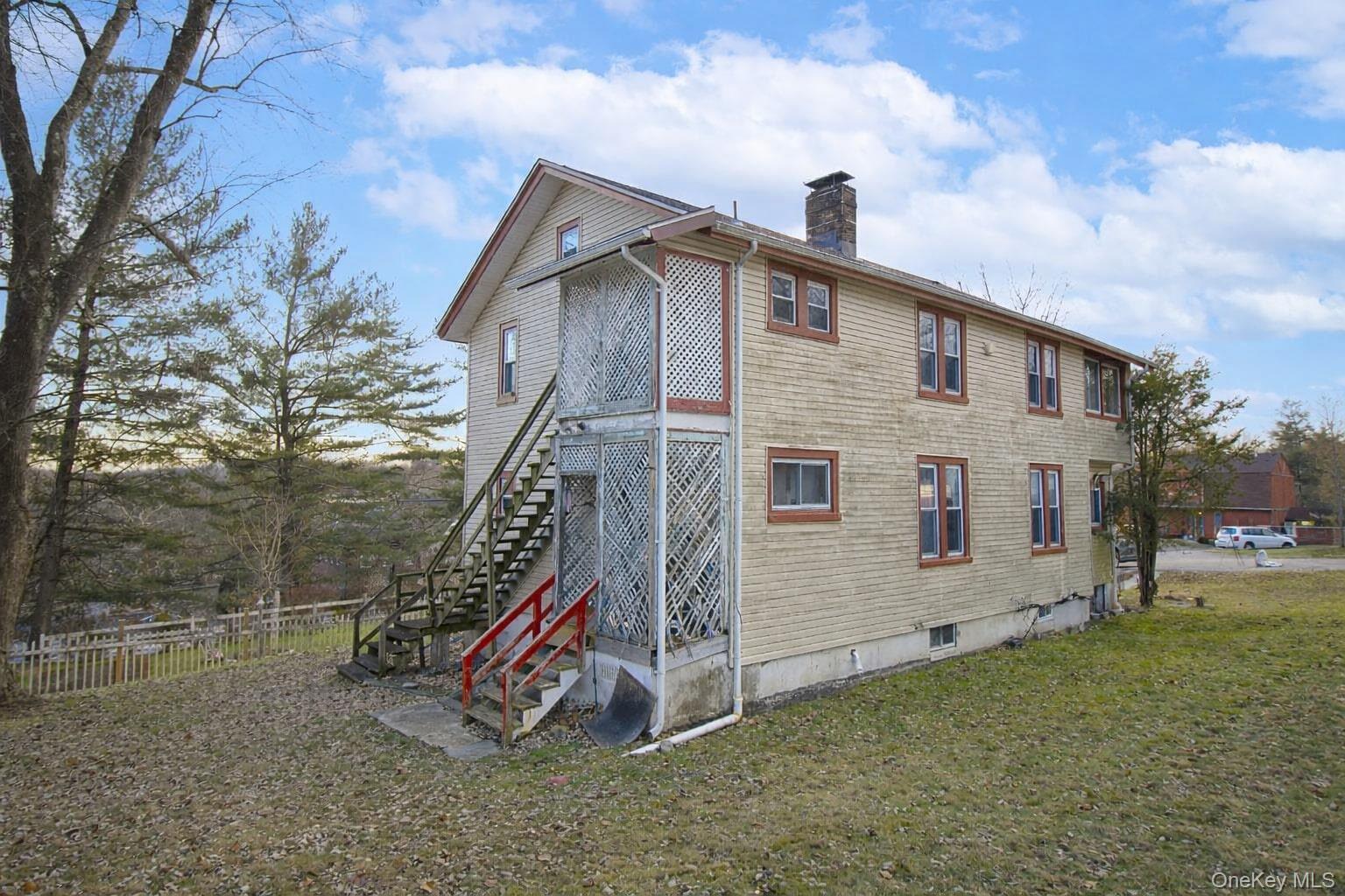 6 Stowe Road Peekskill, NY 10566 - Photo 10 of 17 View of side of home featuring stairs and a chimney