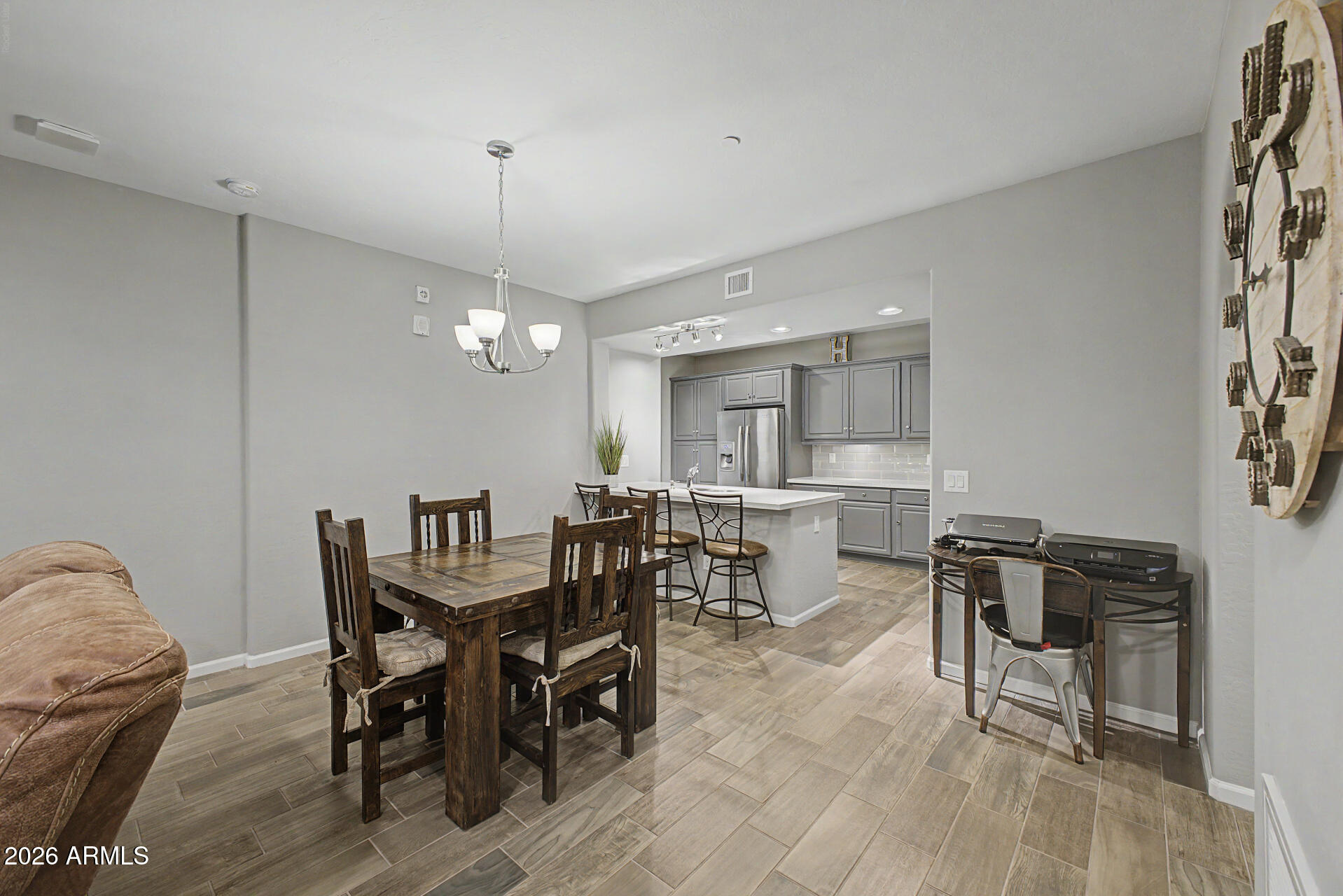 3935 East Rough Rider Road, Unit 1339 Phoenix, AZ 85050 - Photo 11 of 36 a view of a dining room with furniture