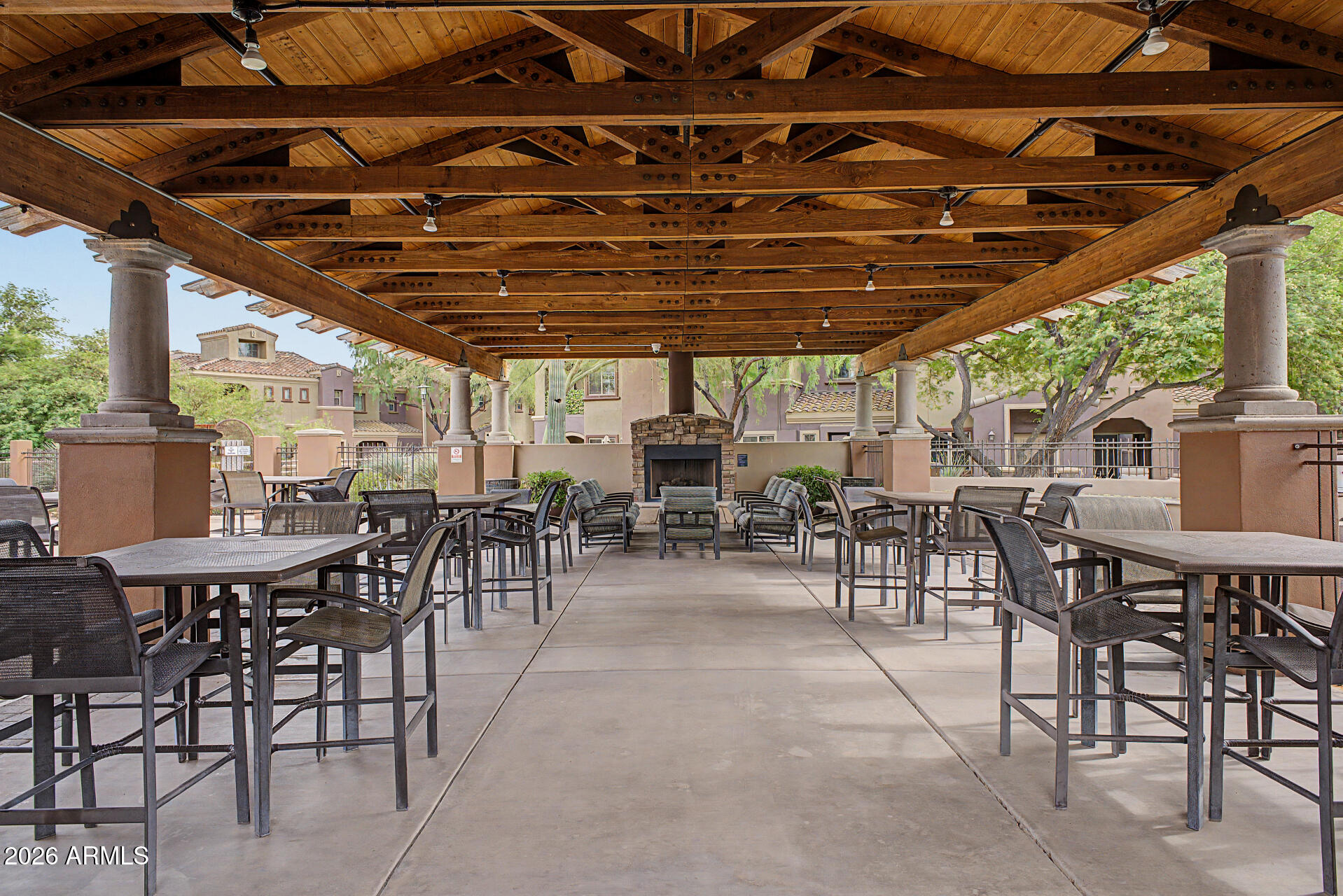 3935 East Rough Rider Road, Unit 1339 Phoenix, AZ 85050 - Photo 33 of 36 a view of a dinning table and chairs in the patio
