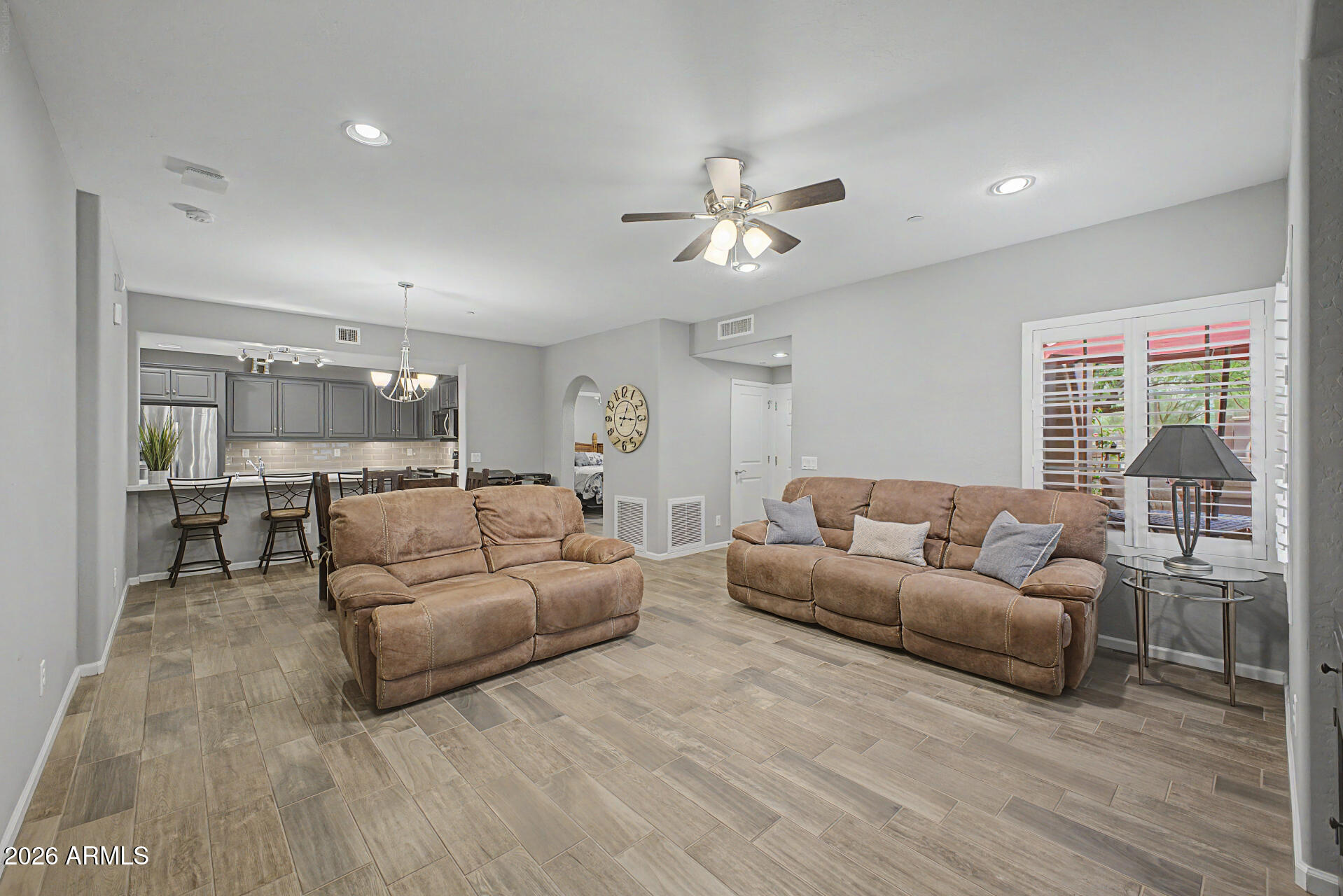 3935 East Rough Rider Road, Unit 1339 Phoenix, AZ 85050 - Photo 6 of 36 a living room with furniture and a large window