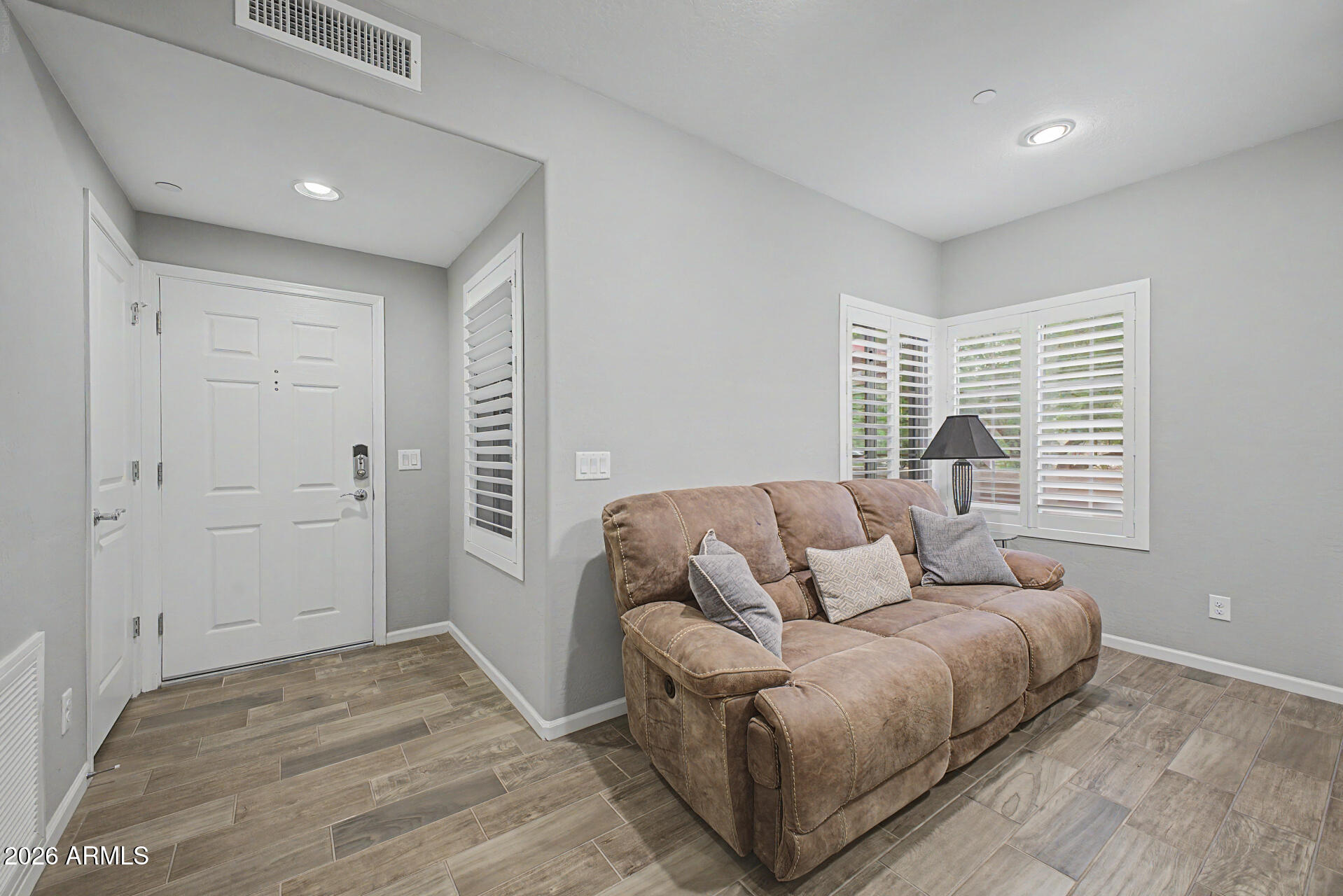 3935 East Rough Rider Road, Unit 1339 Phoenix, AZ 85050 - Photo 9 of 36 a living room with furniture and a window