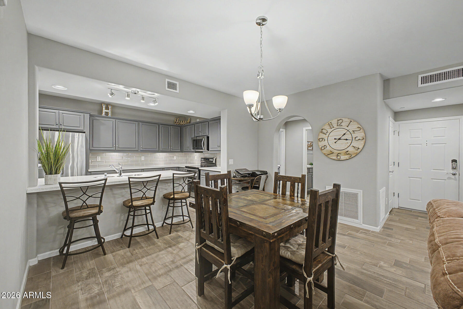 3935 East Rough Rider Road, Unit 1339 Phoenix, AZ 85050 - Photo 10 of 36 a view of a dining room and livingroom view