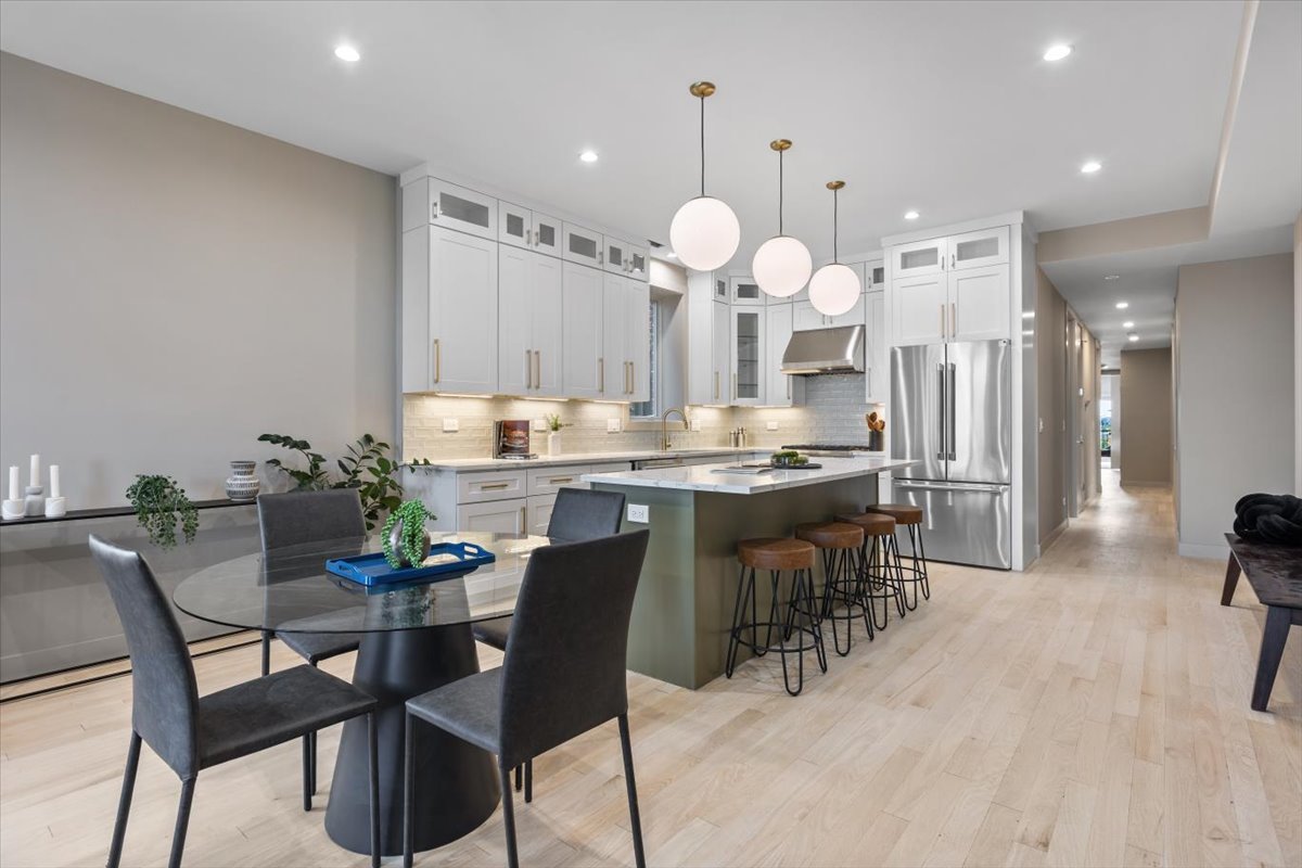 2448 North Clybourn Avenue, Unit 4 Chicago, IL 60614 - Photo 10 of 24 a large kitchen with a table and chairs