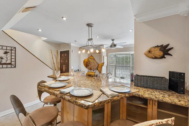 a kitchen with a table and chairs in it