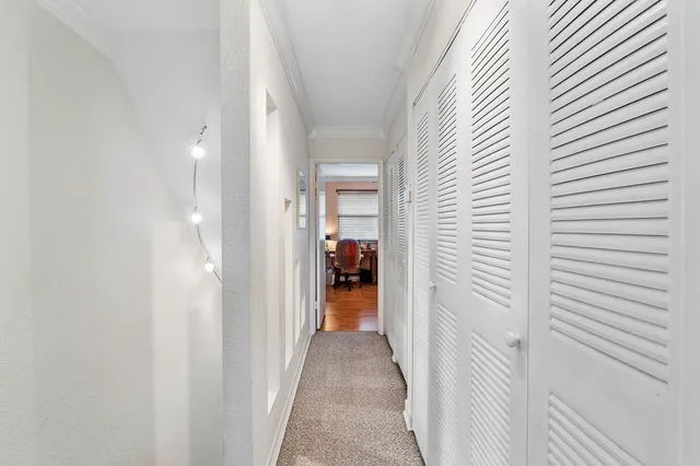 a view of a bedroom from a hallway