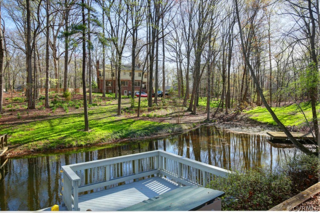2715 West Brigstock Road Midlothian, VA 23113 - Photo 23 of 24 a view of a wooden deck with a lake view