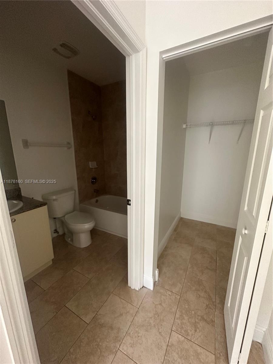 211 West 79th Place, Unit 302 Hialeah, FL 33014 - Photo 13 of 16 a bathroom with a toilet and a shower