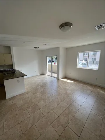 a view of an empty room and window
