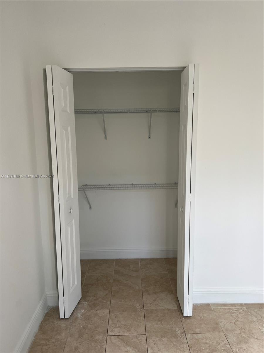 211 West 79th Place, Unit 302 Hialeah, FL 33014 - Photo 8 of 16 an empty room