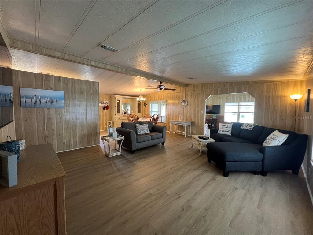 2055 South Floral Avenue, Unit 133 Bartow, FL 33830 - Photo 16 of 62 a living room with furniture and a flat screen tv