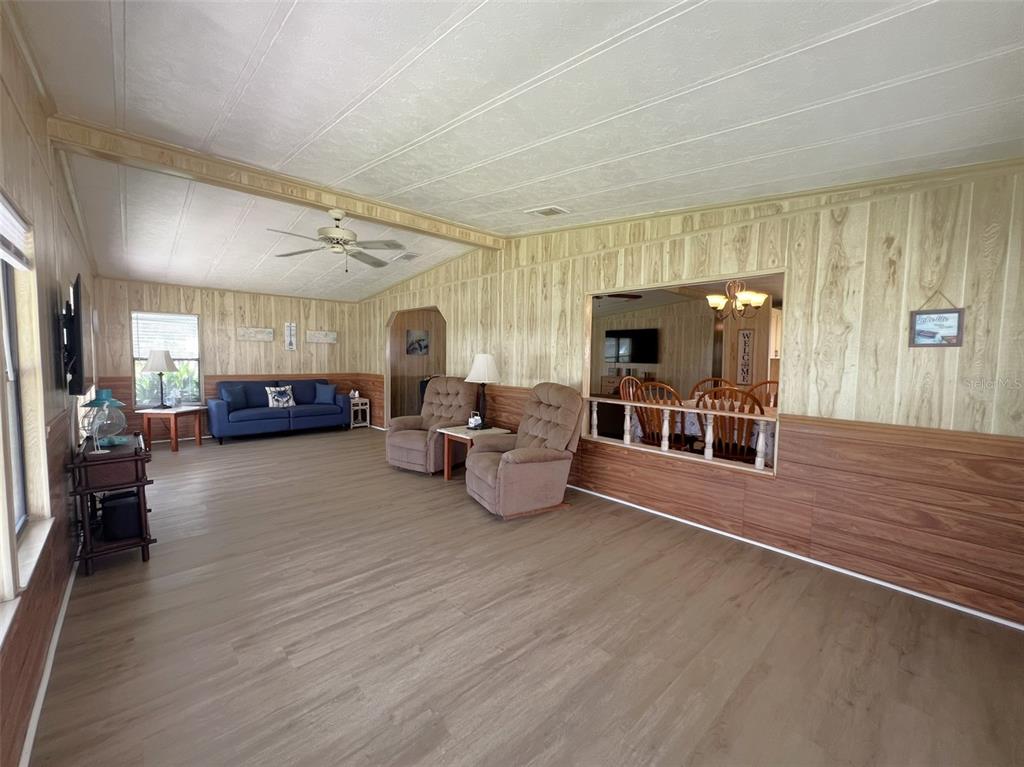 2055 South Floral Avenue, Unit 133 Bartow, FL 33830 - Photo 20 of 62 a living room with furniture and a flat screen tv
