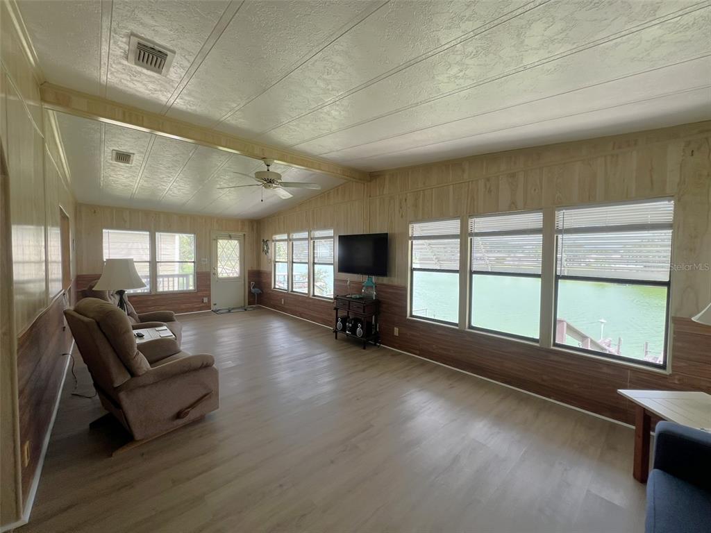2055 South Floral Avenue, Unit 133 Bartow, FL 33830 - Photo 24 of 62 a living room with furniture and large windows