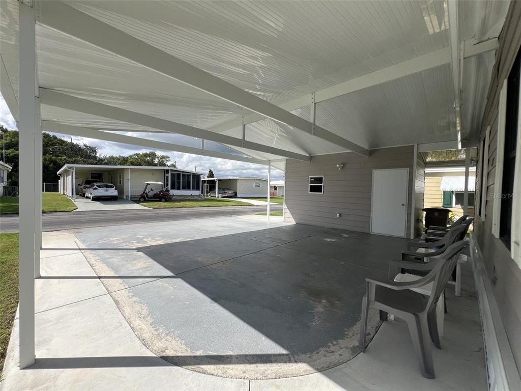 2055 South Floral Avenue, Unit 133 Bartow, FL 33830 - Photo 46 of 62 a living room with furniture a flat screen tv and a table