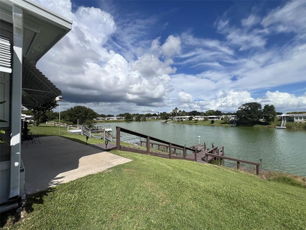 2055 South Floral Avenue, Unit 133 Bartow, FL 33830 - Photo 49 of 62 a view of a lake with a yard