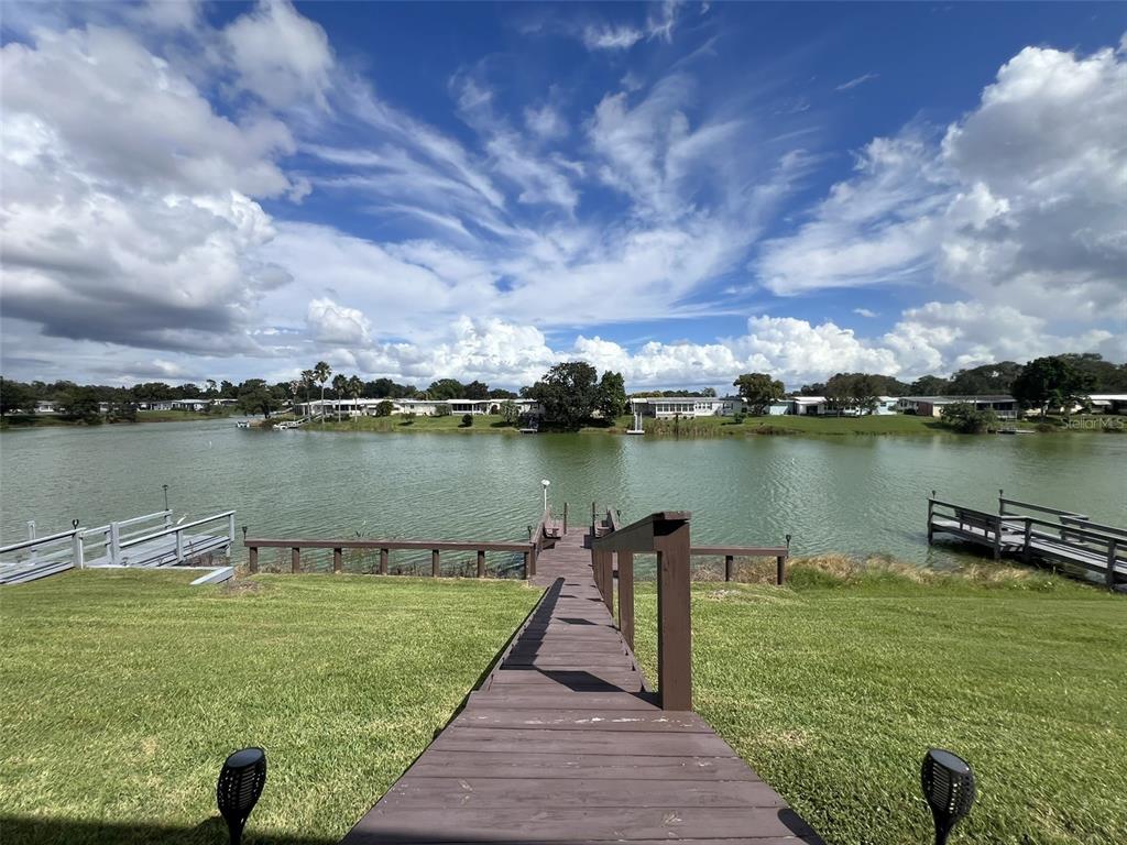 2055 South Floral Avenue, Unit 133 Bartow, FL 33830 - Photo 51 of 62 a view of a lake with a yard