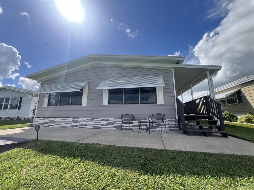 2055 South Floral Avenue, Unit 133 Bartow, FL 33830 - Photo 57 of 62 a front view of a house with a yard