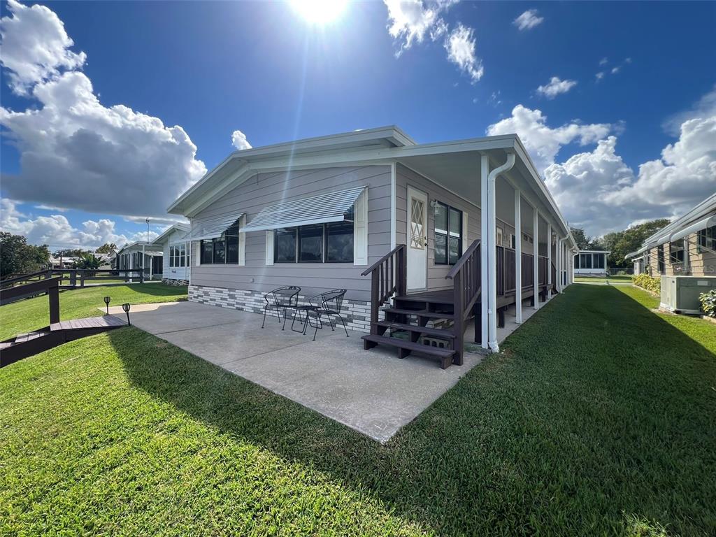 2055 South Floral Avenue, Unit 133 Bartow, FL 33830 - Photo 58 of 62 a view of a house with backyard porch and sitting area