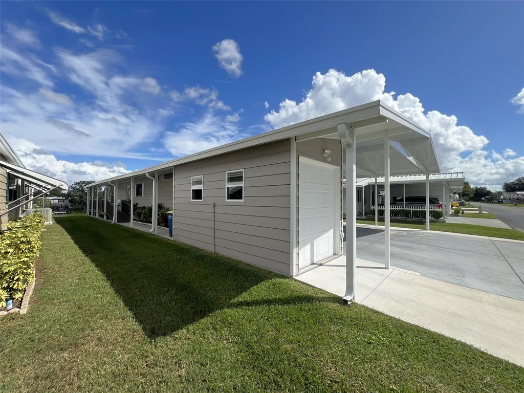 2055 South Floral Avenue, Unit 133 Bartow, FL 33830 - Photo 61 of 62 a view of a house with a yard