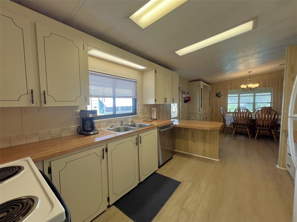 2055 South Floral Avenue, Unit 133 Bartow, FL 33830 - Photo 9 of 62 a kitchen with a sink and a large window