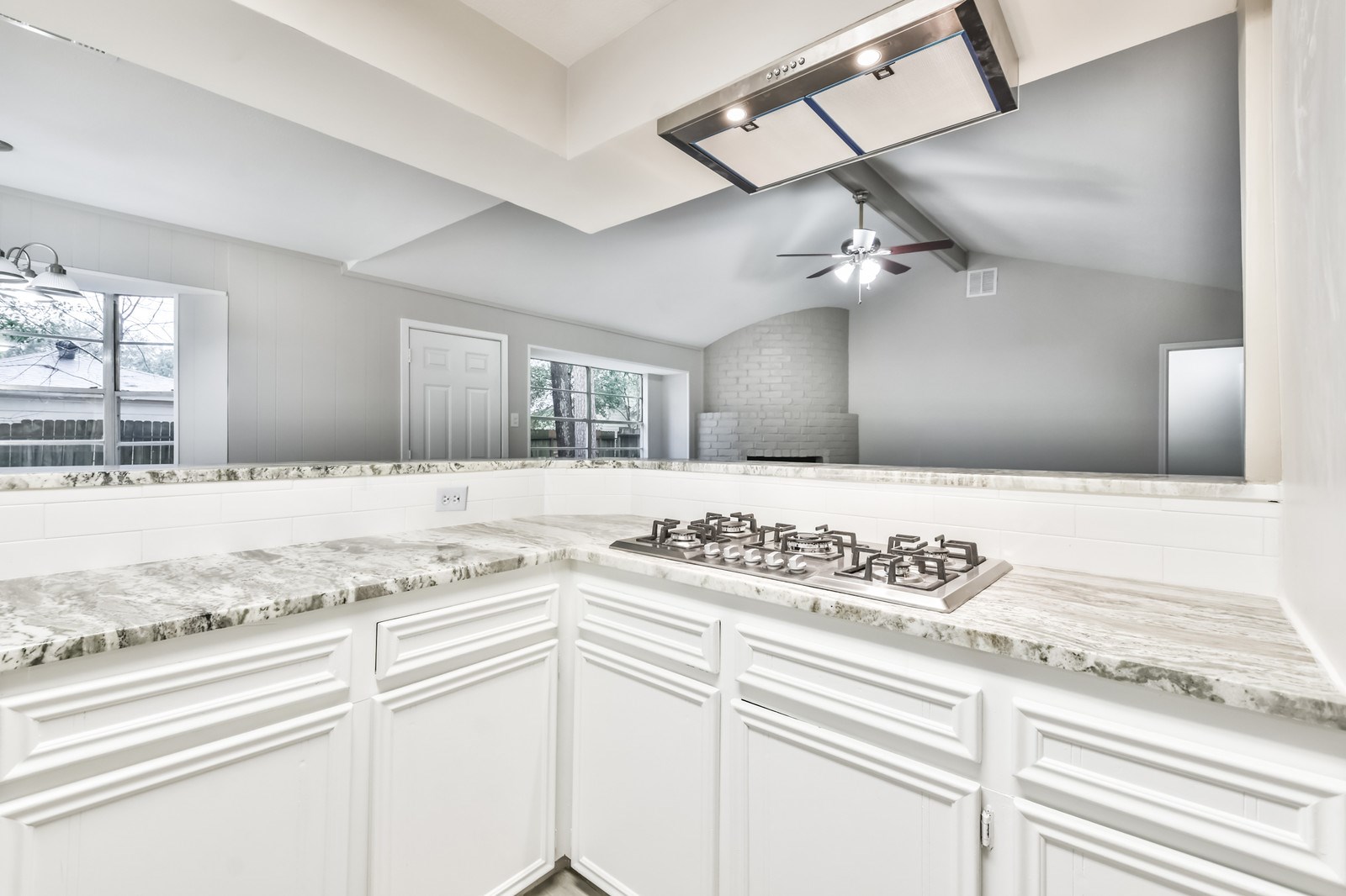 9718 John Bank Drive Spring, TX 77379 - Photo 11 of 39 a kitchen with a stove cabinets and window
