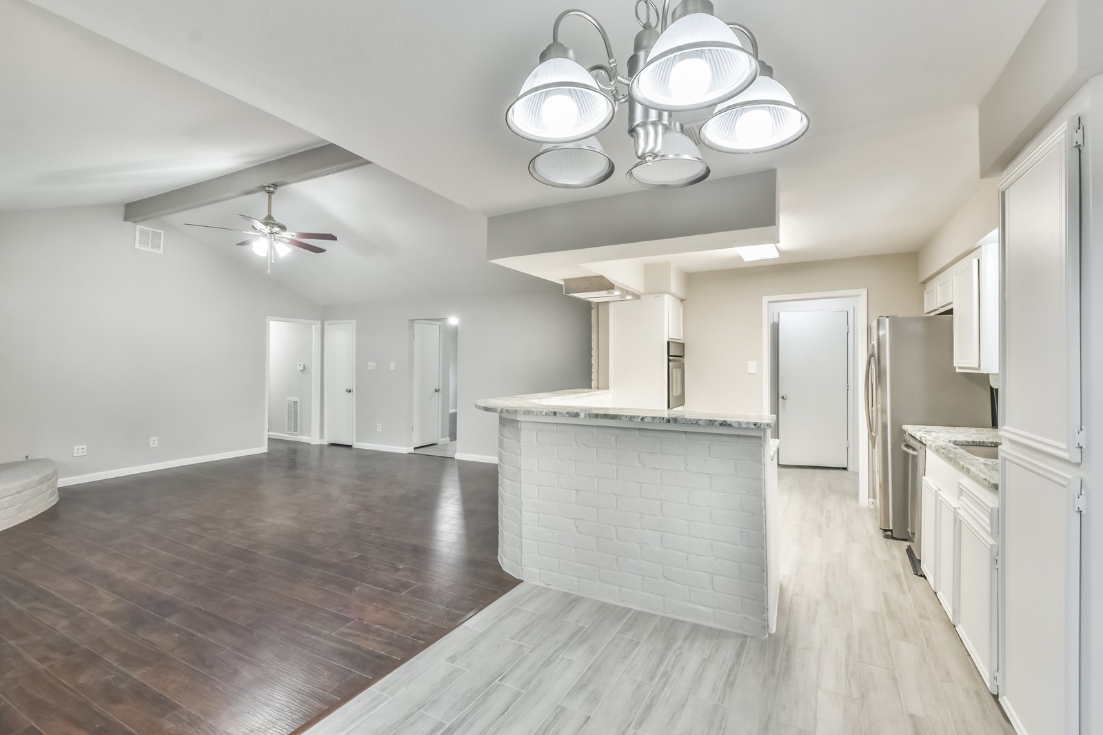 9718 John Bank Drive Spring, TX 77379 - Photo 19 of 39 a view of a kitchen center island and stainless steel appliances