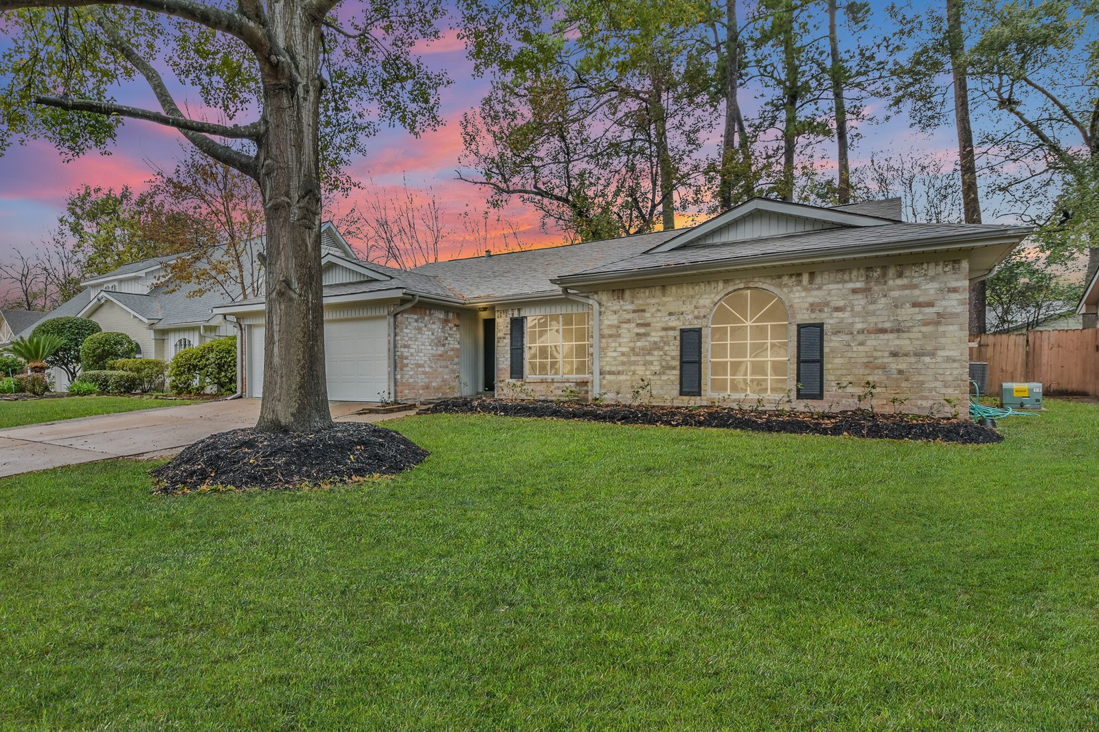 9718 John Bank Drive Spring, TX 77379 - Photo 3 of 39 a view of a house with a garden