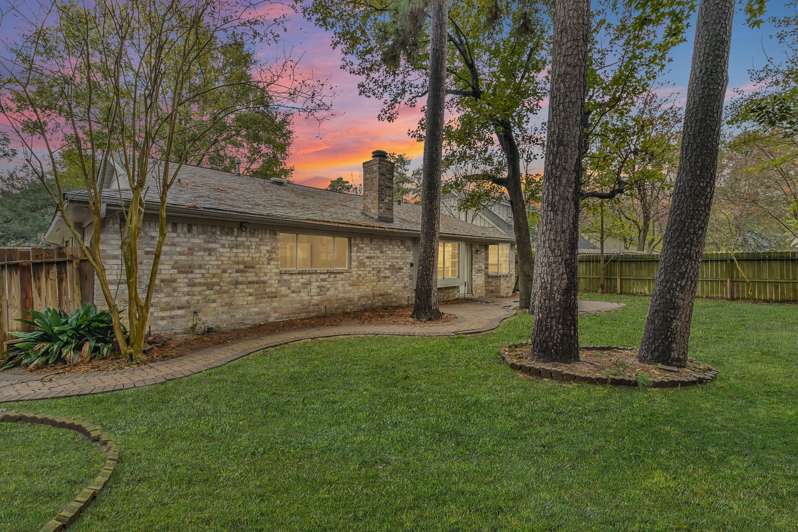 9718 John Bank Drive Spring, TX 77379 - Photo 32 of 39 a view of a backyard with large trees