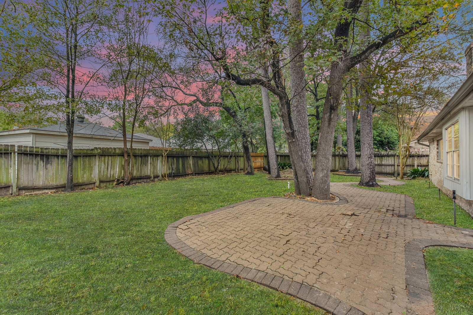 9718 John Bank Drive Spring, TX 77379 - Photo 33 of 39 a view of a yard with a tree
