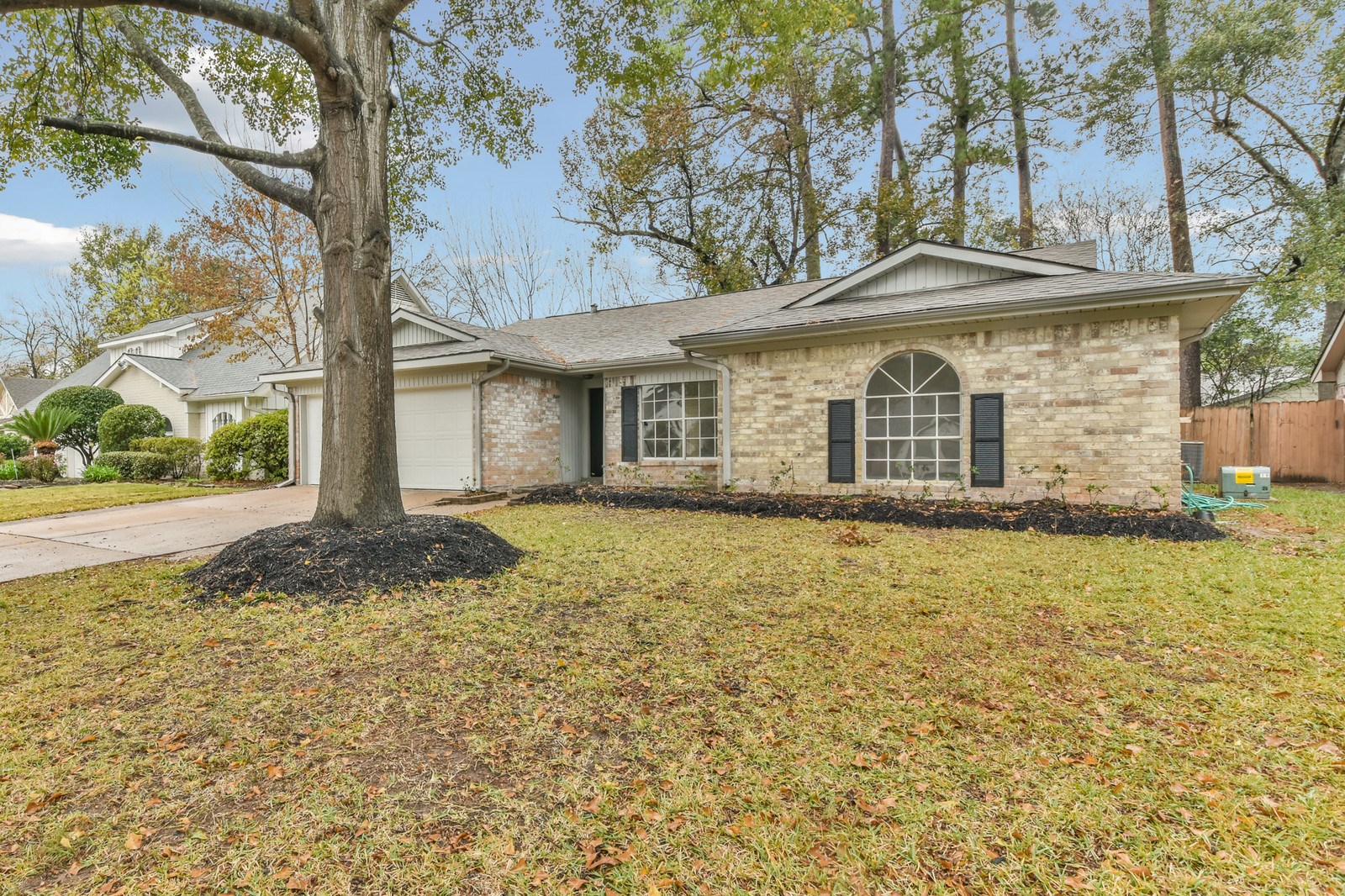 9718 John Bank Drive Spring, TX 77379 - Photo 36 of 39 front view of a house with a yard