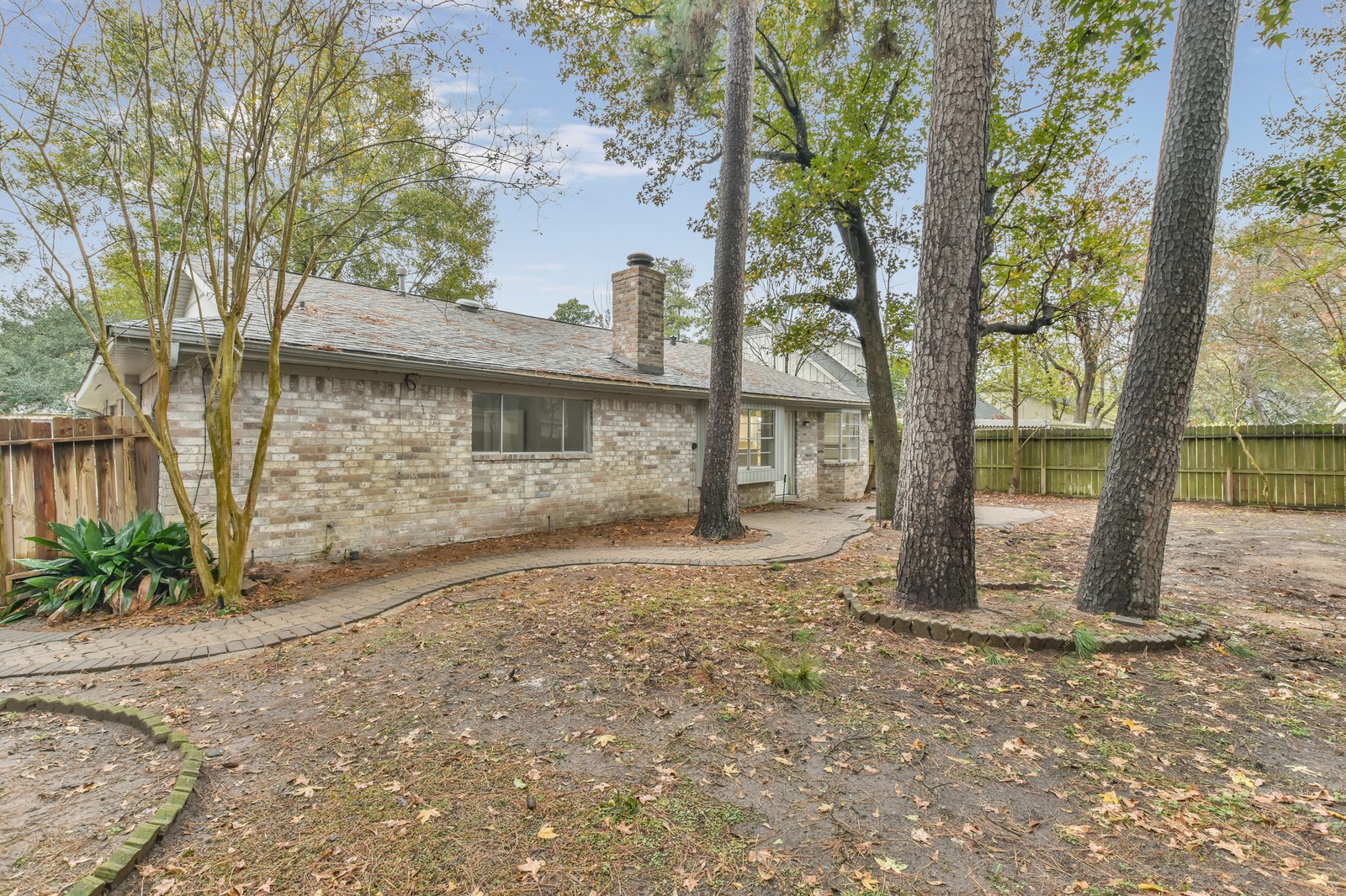 9718 John Bank Drive Spring, TX 77379 - Photo 38 of 39 a view of a house with a tree in the background