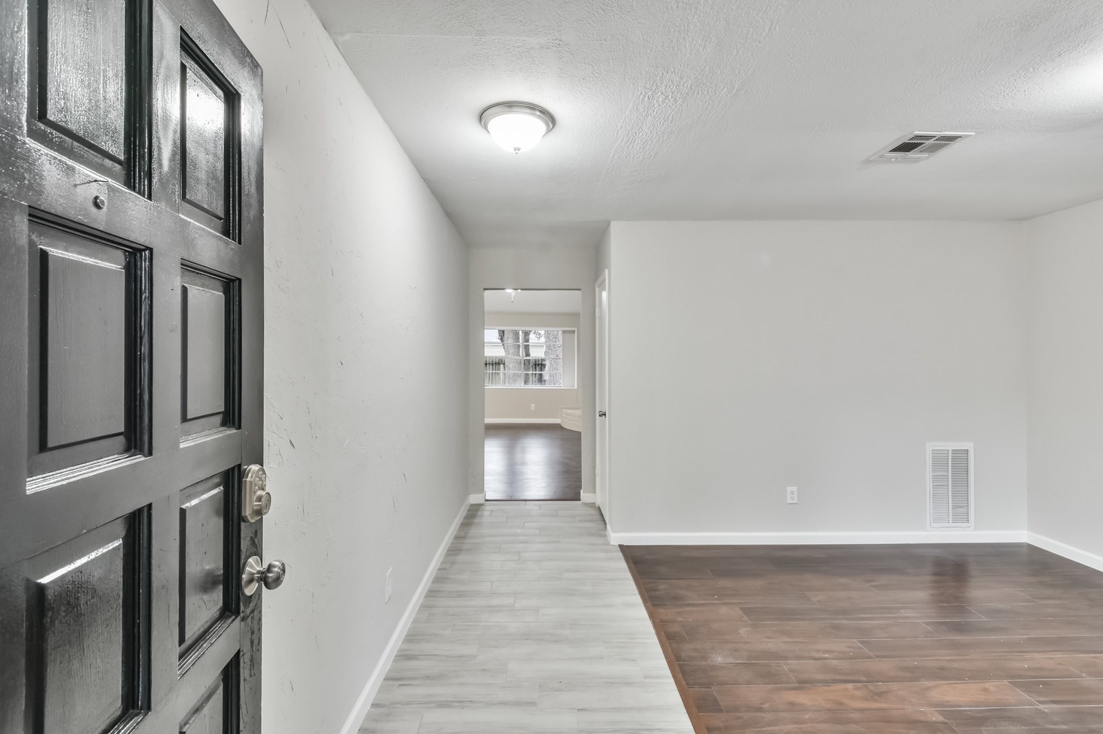 9718 John Bank Drive Spring, TX 77379 - Photo 4 of 39 a view of a hallway with a white walls