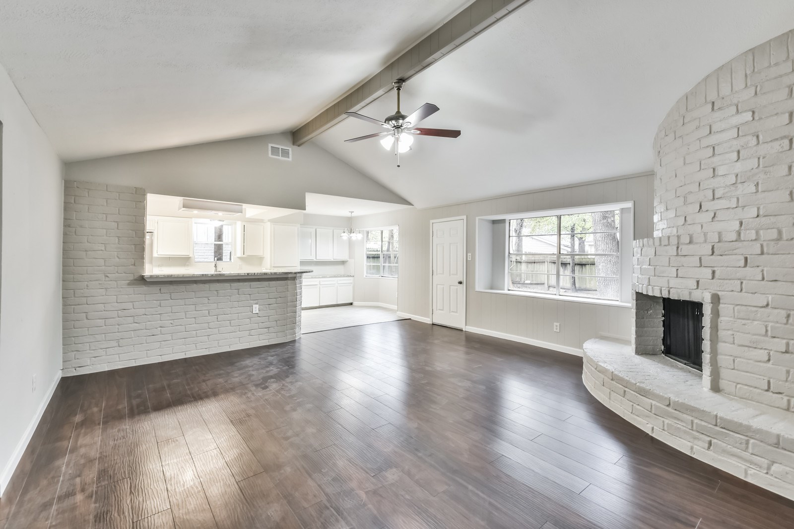 9718 John Bank Drive Spring, TX 77379 - Photo 8 of 39 a view of an empty room with a fireplace and a window