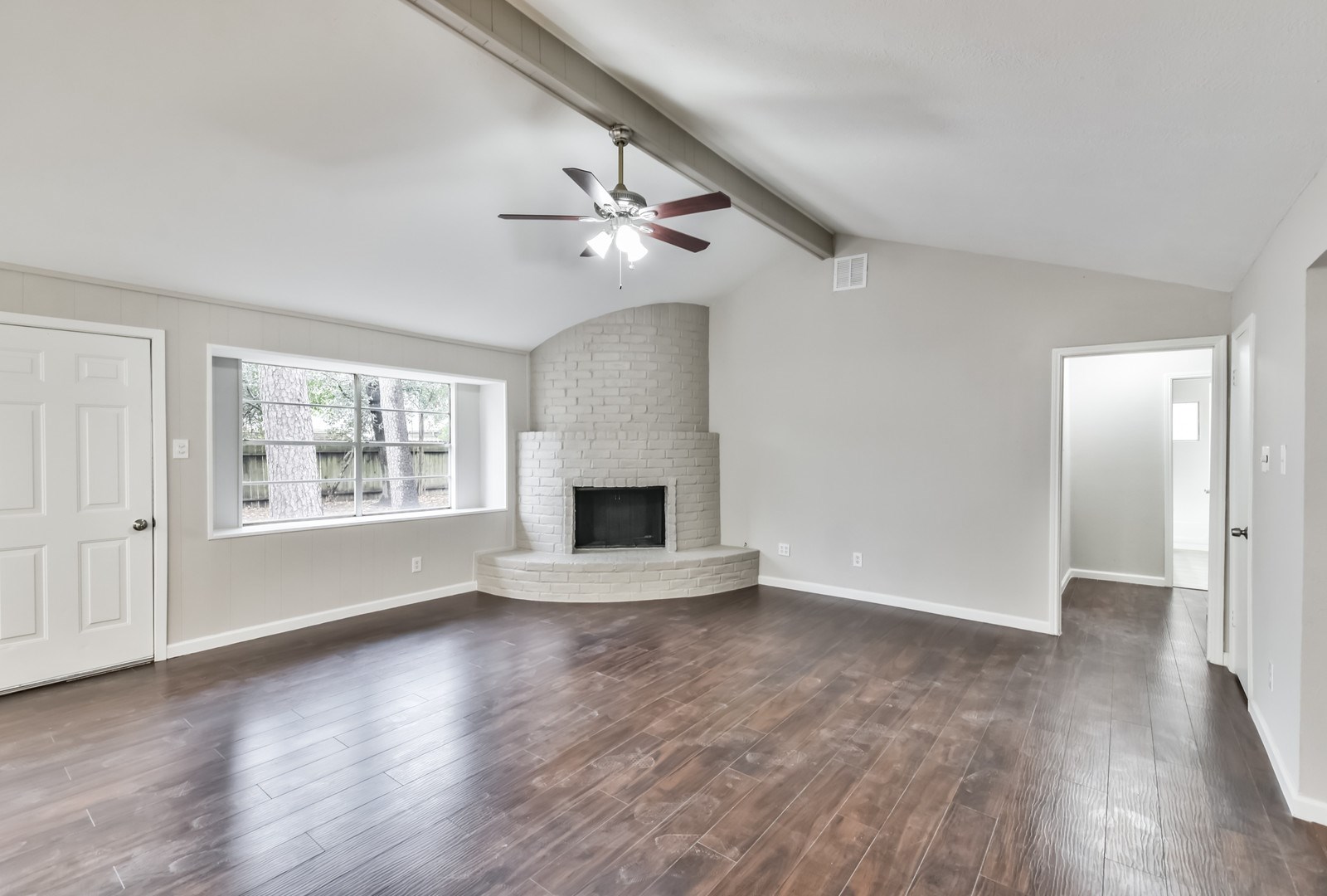 9718 John Bank Drive Spring, TX 77379 - Photo 9 of 39 wooden floor in an empty room with a window