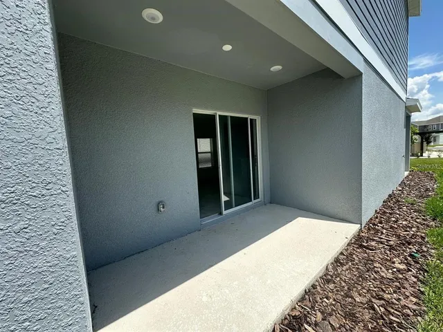a bathroom with a shower and a glass door