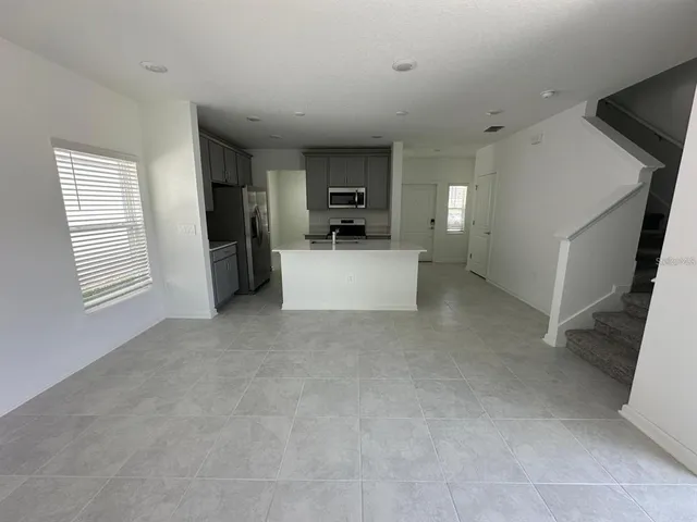 a bathroom with a shower and a sink
