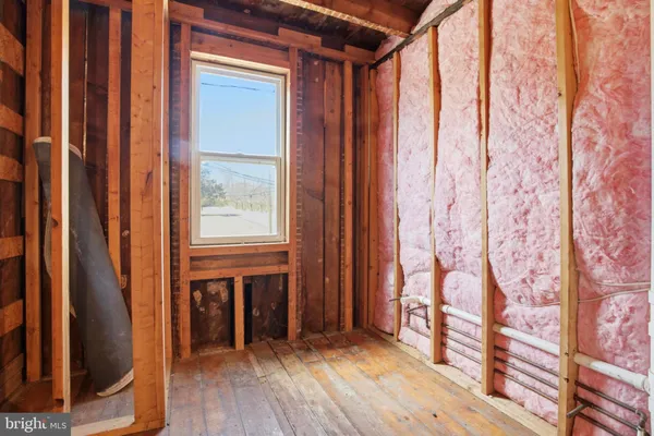 a view of front door with wooden floor