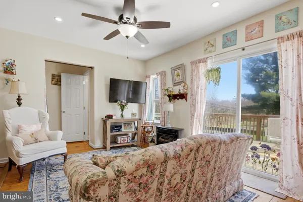 a bedroom with a large bed and a flat screen tv
