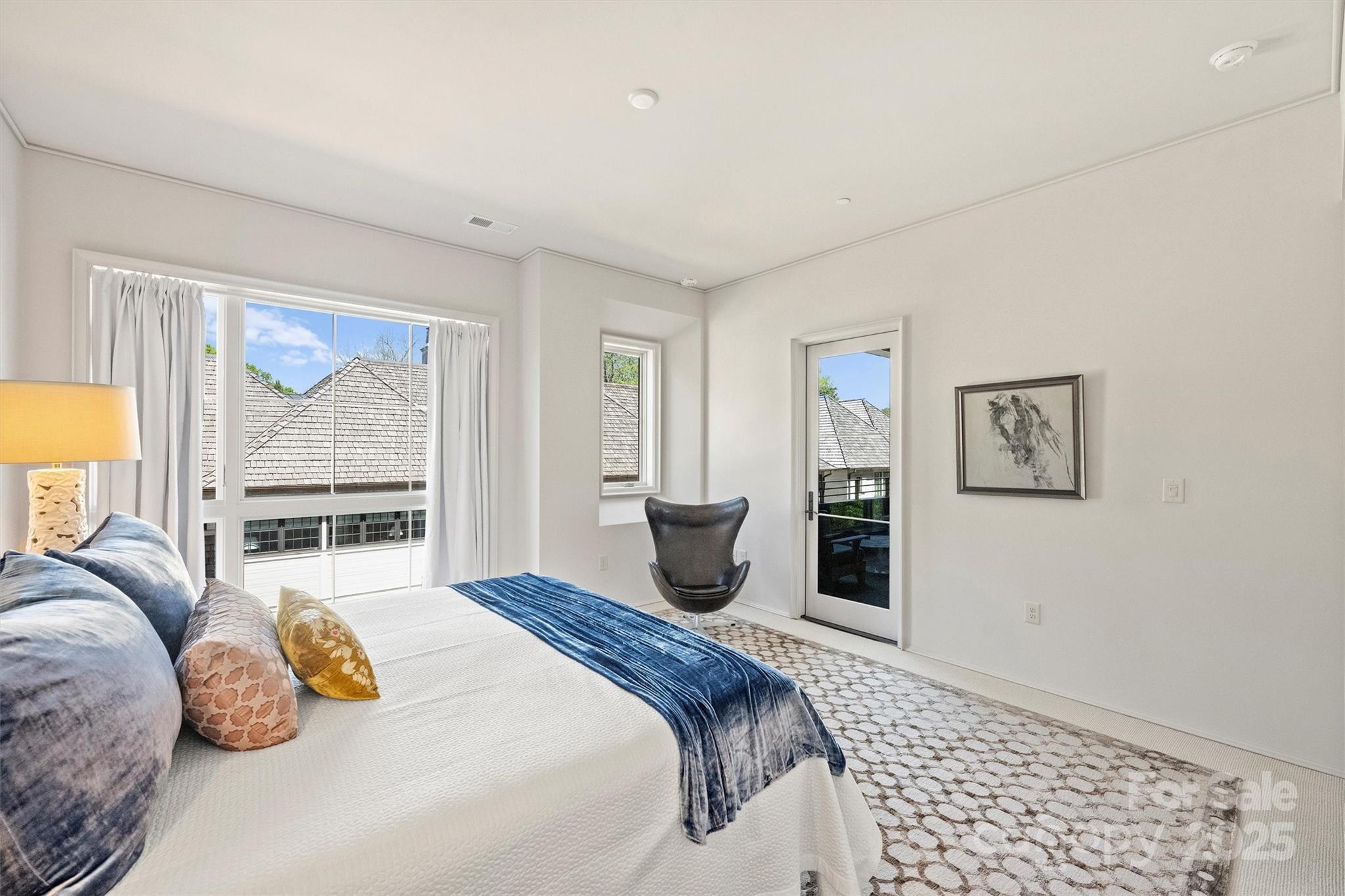 1170 Queens Road Charlotte, NC 28207 - Photo 14 of 29 a bedroom with a large bed and a window