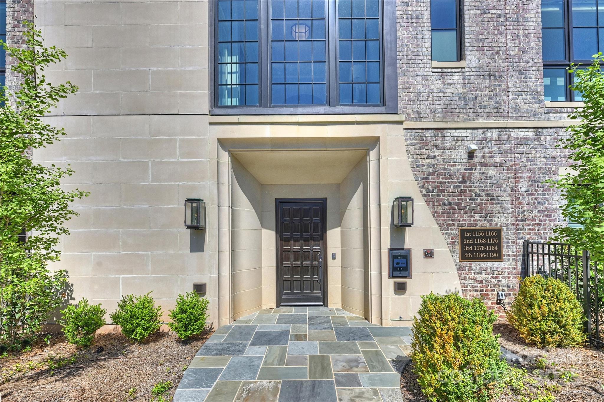 1170 Queens Road Charlotte, NC 28207 - Photo 29 of 29 a front view of a house with a garden
