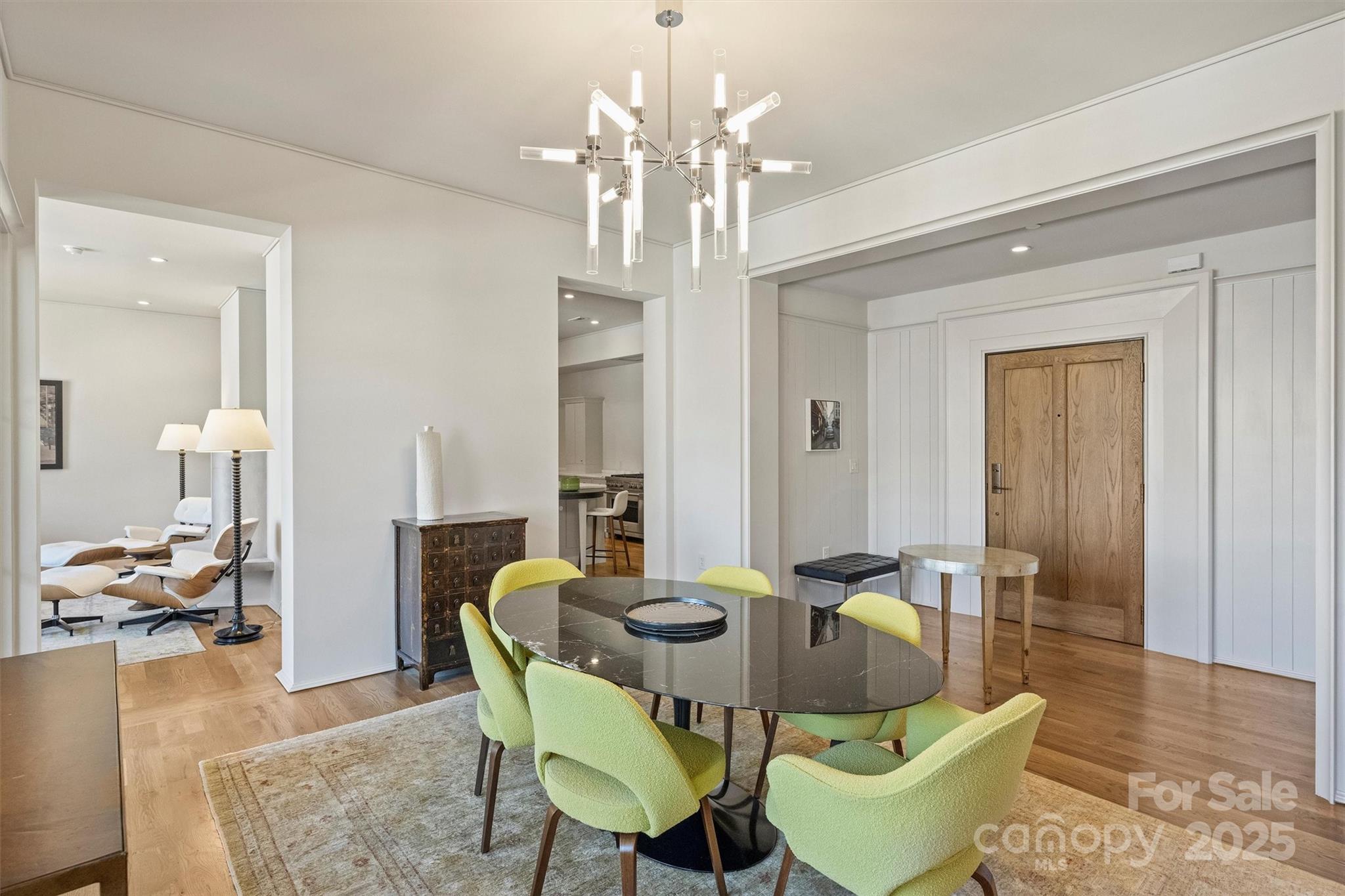 1170 Queens Road Charlotte, NC 28207 - Photo 6 of 29 a view of a dining room with furniture and wooden floor
