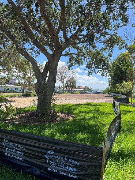 175 Bath Club Boulevard North North Redington Beach, FL 33708 - Photo 7 of 10 a view of a yard with wooden fence