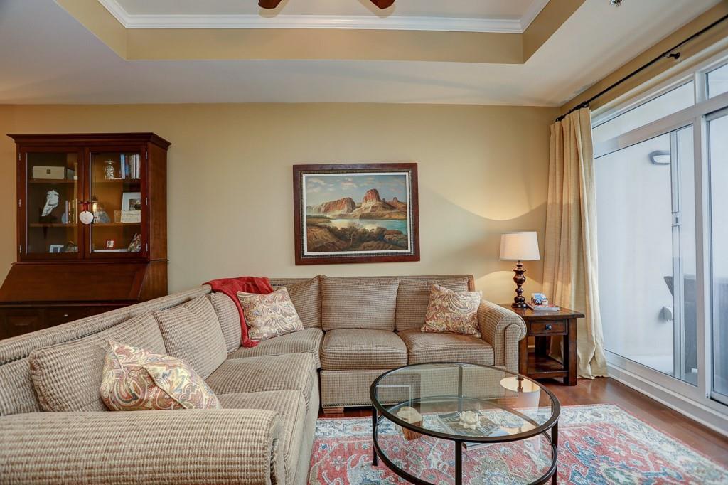 325 East Paces Ferry Road Northeast, Unit 1510 Atlanta, GA 30305 - Photo 11 of 33 a living room with furniture and a window