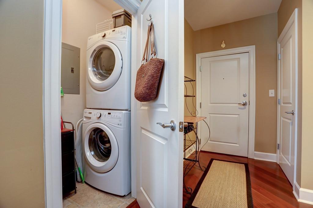 325 East Paces Ferry Road Northeast, Unit 1510 Atlanta, GA 30305 - Photo 18 of 33 a utility room with dryer and washer