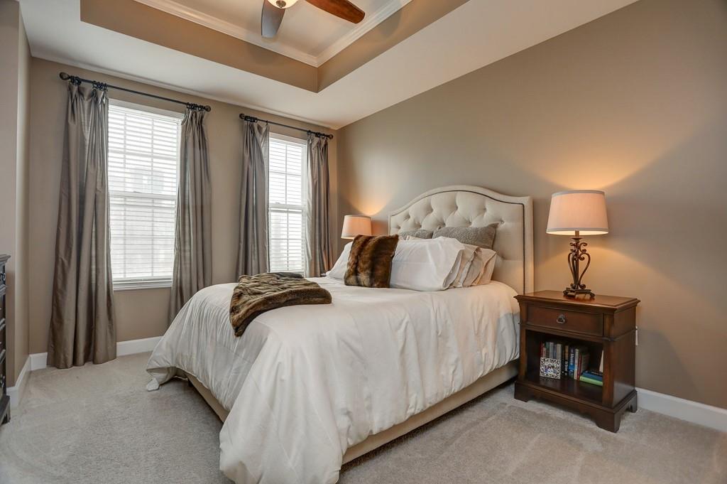 325 East Paces Ferry Road Northeast, Unit 1510 Atlanta, GA 30305 - Photo 22 of 33 a bedroom with a bed and a window