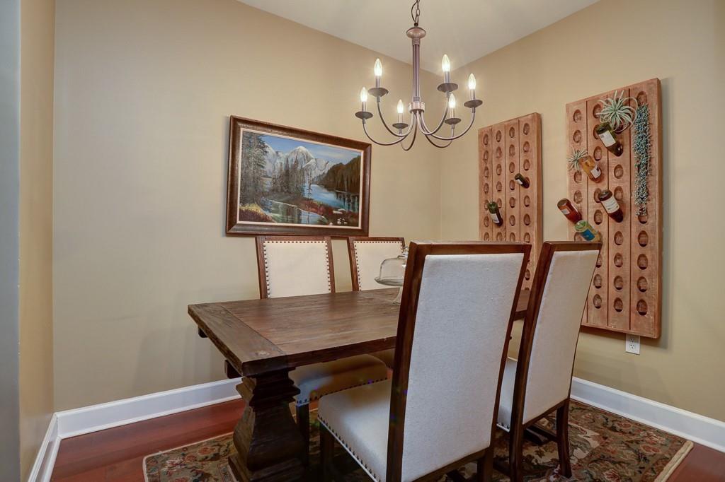 325 East Paces Ferry Road Northeast, Unit 1510 Atlanta, GA 30305 - Photo 4 of 33 a view of a dining room with furniture and chandelier